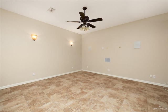 empty room with a ceiling fan, visible vents, and baseboards