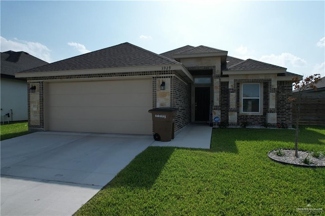3929 Burr Dr, Edinburg, TX 78542 - view of front of property with brick siding, a garage, driveway, a front lawn, and a shingled roof