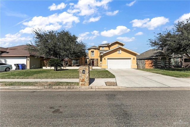 view of front of home featuring a garage and a front lawn