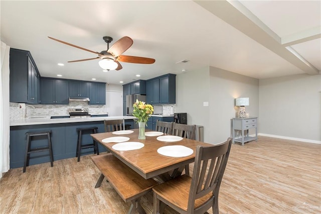 1409 Pine Ct, Harlingen, TX 78550 - dining area featuring light wood finished floors, ceiling fan, and recessed lighting