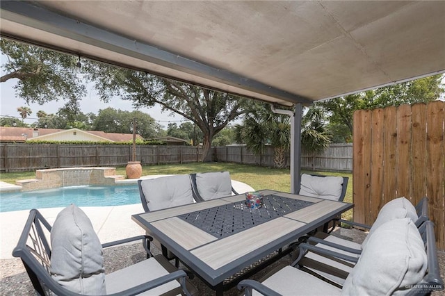 1409 Pine Ct, Harlingen, TX 78550 - view of swimming pool with a fenced backyard, outdoor dining space, and a patio