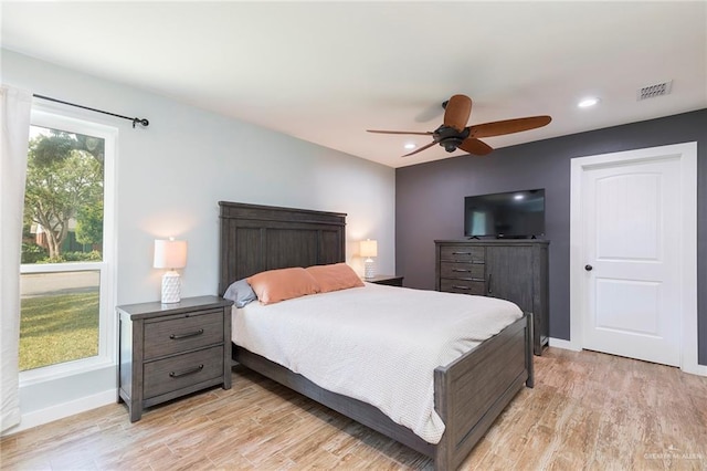 1409 Pine Ct, Harlingen, TX 78550 - bedroom featuring light wood-style flooring, ceiling fan, and recessed lighting
