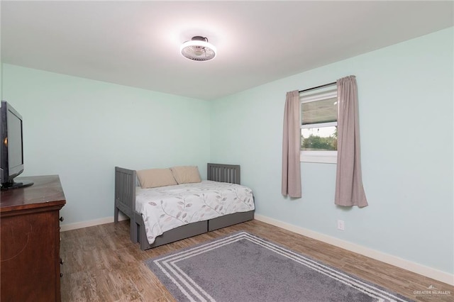 1409 Pine Ct, Harlingen, TX 78550 - bedroom featuring wood finished floors and baseboards
