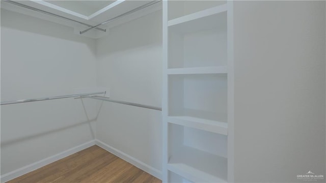 walk in closet featuring hardwood / wood-style floors