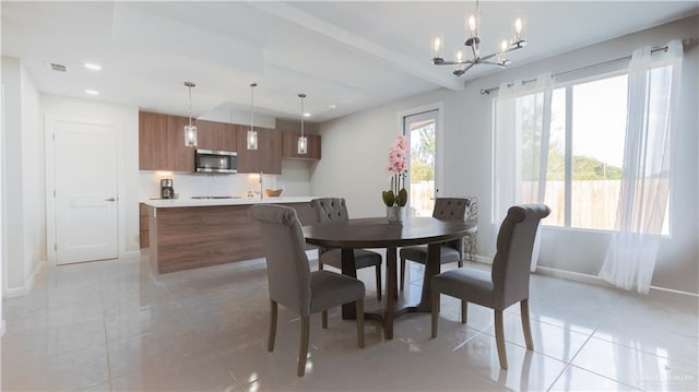 dining area with beamed ceiling, light tile patterned floors, and an inviting chandelier