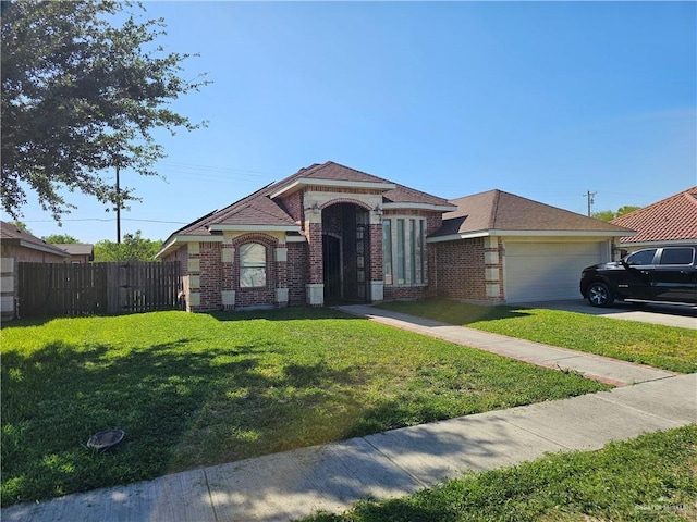 view of front facade featuring concrete driveway, brick siding, fence, and a front lawn