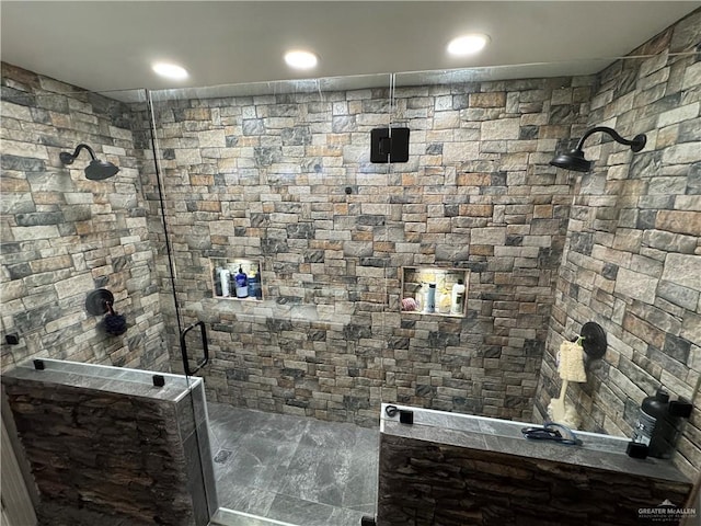 bathroom with a walk in shower and recessed lighting