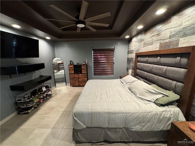 bedroom with a ceiling fan, recessed lighting, a raised ceiling, and baseboards