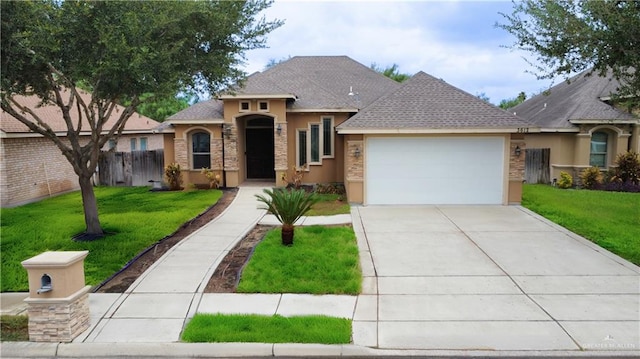 view of front of house with a garage and a front lawn