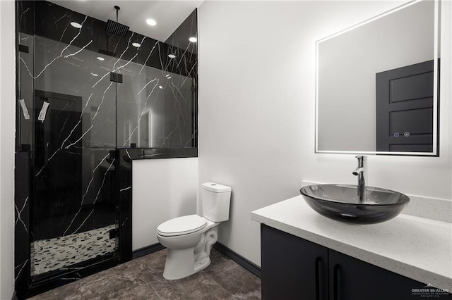 509 Demi St, Edinburg, TX 78542 - full bath featuring toilet, a marble finish shower, baseboards, vanity, and recessed lighting