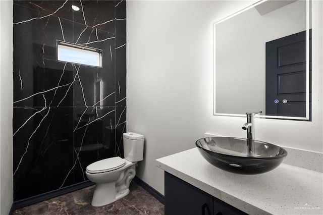 509 Demi St, Edinburg, TX 78542 - full bath featuring toilet, baseboards, vanity, and a marble finish shower