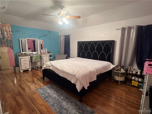 bedroom featuring ceiling fan and dark wood-type flooring