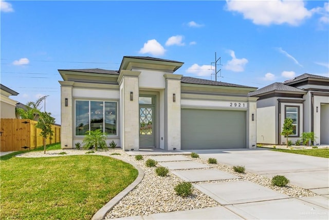 view of front facade with a front yard and a garage