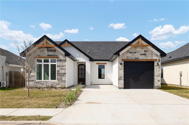 view of front of home featuring a garage and a front lawn