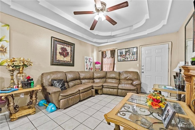 tiled living room featuring a tray ceiling and ceiling fan