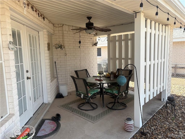 view of patio / terrace with french doors, ceiling fan, and outdoor dining space