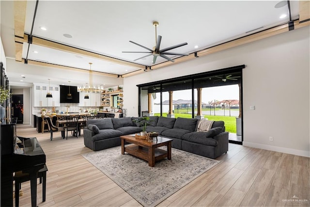 4825 Estancia Pkwy, Mcallen, TX 78504 - living room with a ceiling fan, light wood-style flooring, recessed lighting, a chandelier, and baseboards