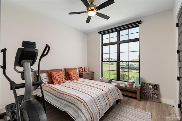 4825 Estancia Pkwy, Mcallen, TX 78504 - bedroom with wood finished floors, baseboards, and a ceiling fan