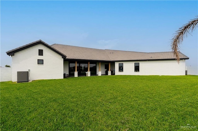 4825 Estancia Pkwy, Mcallen, TX 78504 - back of property with a lawn and central AC unit