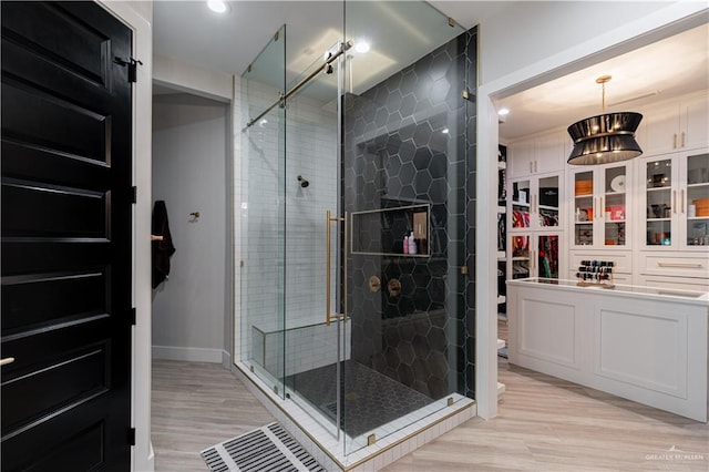 4825 Estancia Pkwy, Mcallen, TX 78504 - bathroom featuring wood finished floors, a stall shower, toilet, and recessed lighting