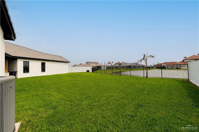 4825 Estancia Pkwy, Mcallen, TX 78504 - view of yard featuring central AC unit and a residential view