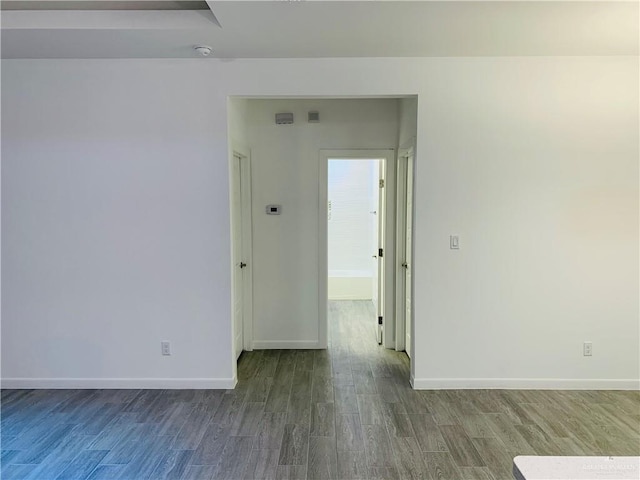 spare room with hardwood / wood-style flooring