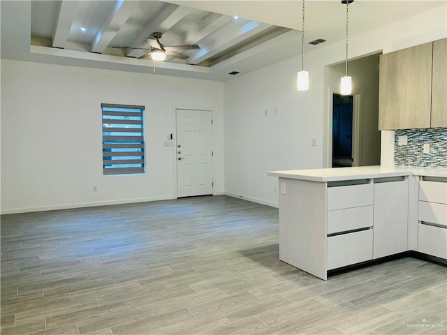 kitchen featuring ceiling fan, white cabinets, pendant lighting, and light wood-type flooring