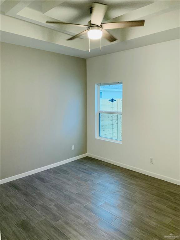 unfurnished room featuring ceiling fan and dark wood-type flooring