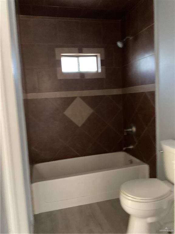 bathroom with toilet and shower / bathtub combination