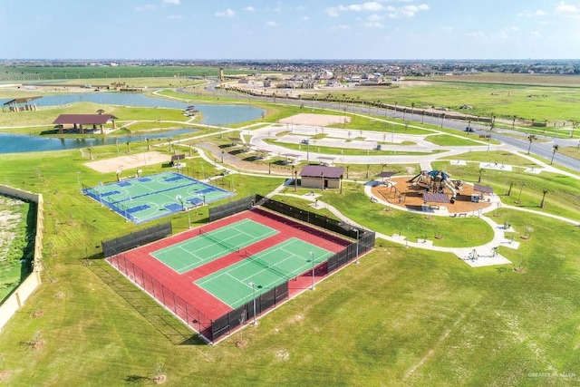 birds eye view of property with a water view