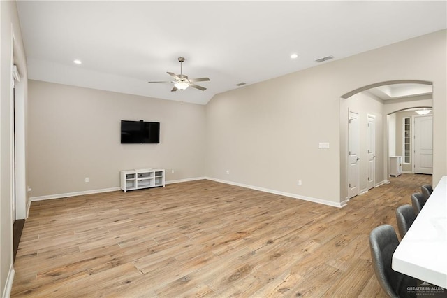 living room with ceiling fan and light wood-type flooring