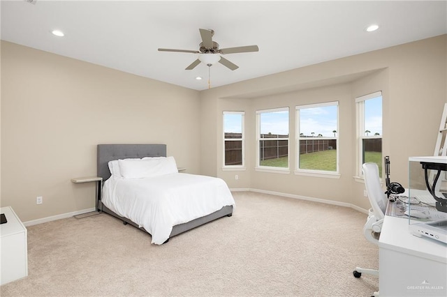 bedroom with light colored carpet and ceiling fan