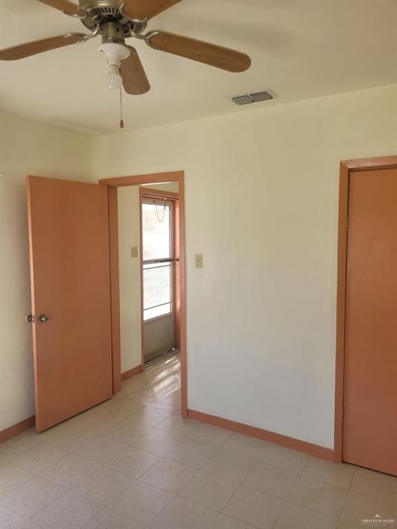 unfurnished room with ceiling fan