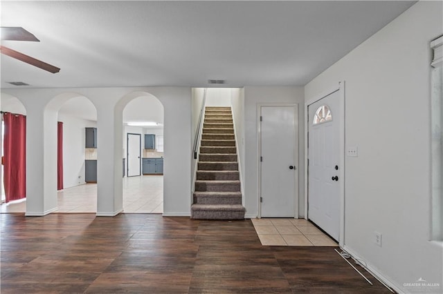 3017 Paradise Ave, Harlingen, TX 78552 - foyer with ceiling fan, stairs, arched walkways, and wood finished floors