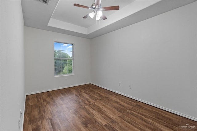 3017 Paradise Ave, Harlingen, TX 78552 - empty room with wood finished floors, a raised ceiling, and a ceiling fan