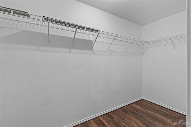 3017 Paradise Ave, Harlingen, TX 78552 - spacious closet featuring dark wood-style floors