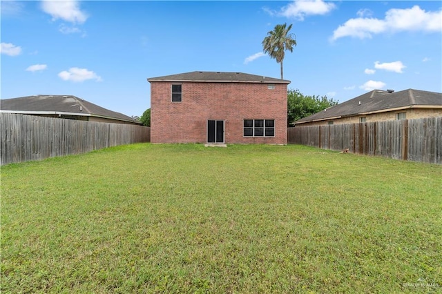 3017 Paradise Ave, Harlingen, TX 78552 - back of property featuring brick siding and a fenced backyard