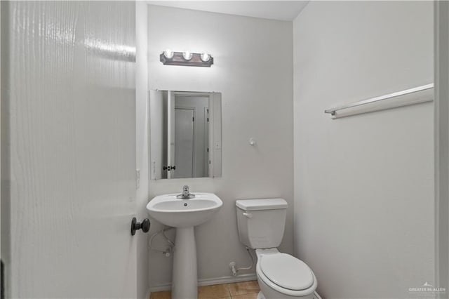 3017 Paradise Ave, Harlingen, TX 78552 - half bath with toilet and tile patterned floors