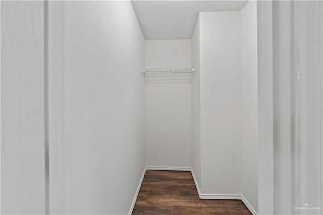 3017 Paradise Ave, Harlingen, TX 78552 - spacious closet with dark wood-style floors