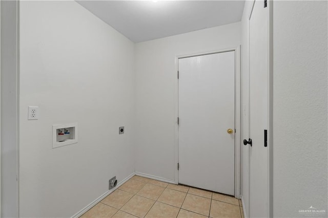 3017 Paradise Ave, Harlingen, TX 78552 - laundry room featuring washer hookup, hookup for an electric dryer, and light tile patterned floors