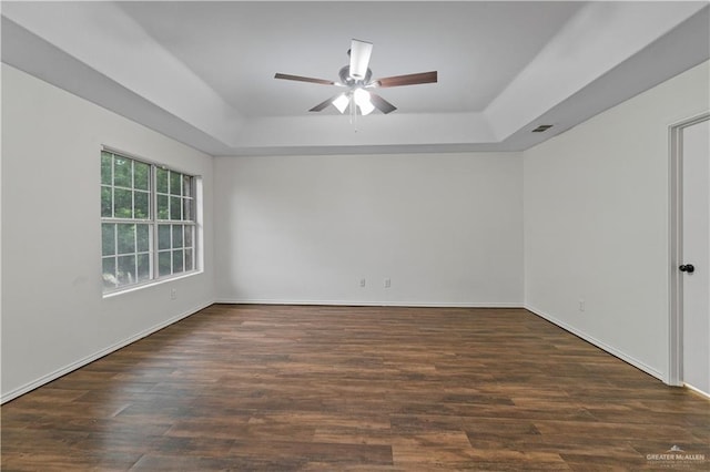 3017 Paradise Ave, Harlingen, TX 78552 - unfurnished room featuring a raised ceiling, ceiling fan, and wood finished floors