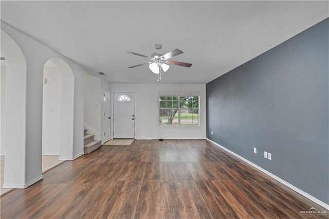 3017 Paradise Ave, Harlingen, TX 78552 - entrance foyer with ceiling fan, wood finished floors, stairway, and arched walkways