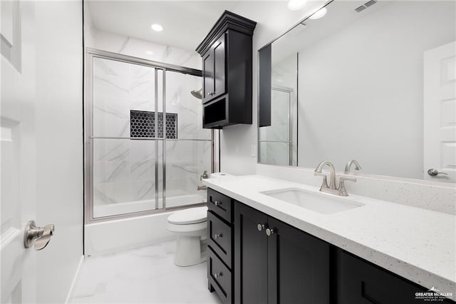 2805 Q St, Hidalgo, TX 78557 - bathroom featuring marble look tiles, vanity, shower / bath combination with glass door, and recessed lighting