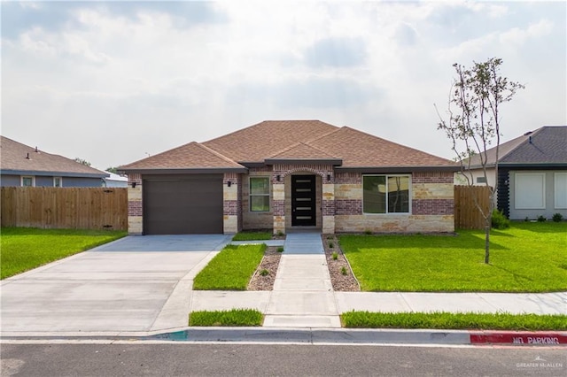 view of front facade with a garage and a front lawn