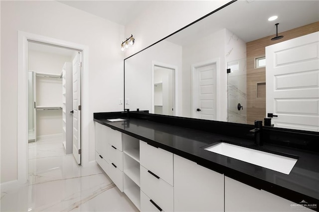 8104 N 51st St N, Mcallen, TX 78504 - bathroom with double vanity, a tile shower, a sink, baseboards, and marble finish floor