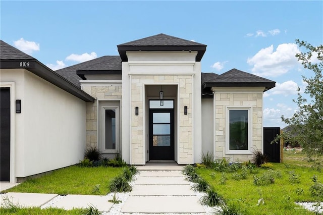 8104 N 51st St N, Mcallen, TX 78504 - property entrance featuring roof with shingles and stone siding