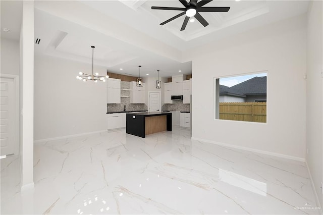 8104 N 51st St N, Mcallen, TX 78504 - kitchen featuring a kitchen island, baseboards, recessed lighting, stainless steel microwave, and ceiling fan with notable chandelier