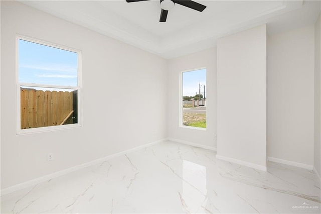 8104 N 51st St N, Mcallen, TX 78504 - unfurnished room featuring baseboards, a ceiling fan, and marble finish floor