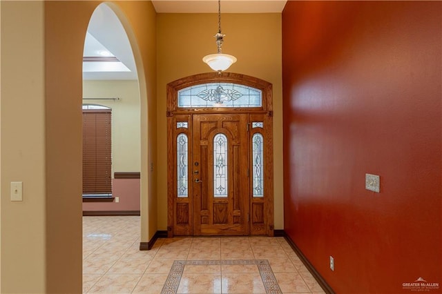 entryway featuring a towering ceiling