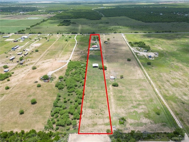 birds eye view of property featuring a rural view